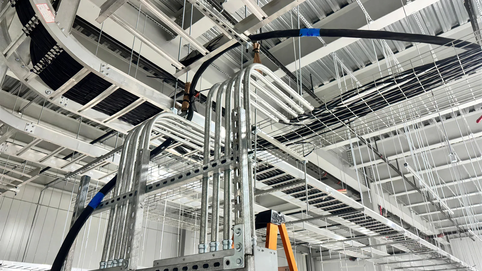 Cable tray run crossing a structural bay